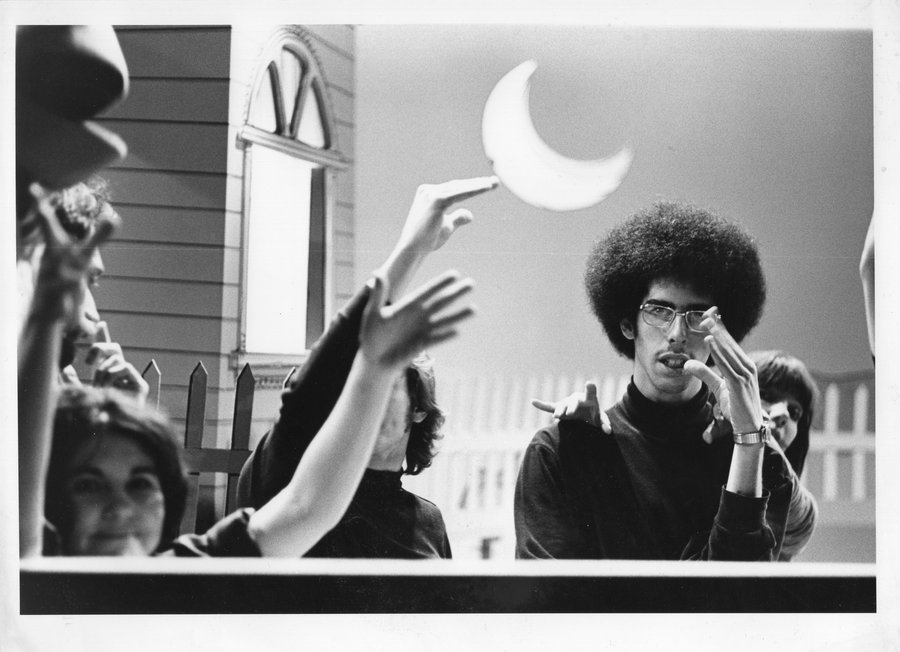 Allan performing with a puppet on the outdoor set of The Letter People