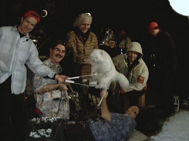 The puppeteer team operating Mr. Tinkles on Cats & Dogs