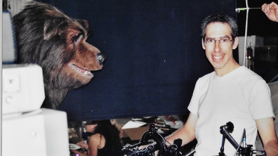 Allan with the head of the Fred character puppet from The Country Bears