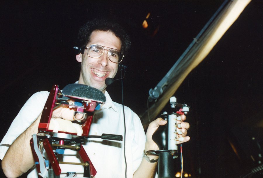 Allan operating the animatronic controls on the set of Dinosaurs
